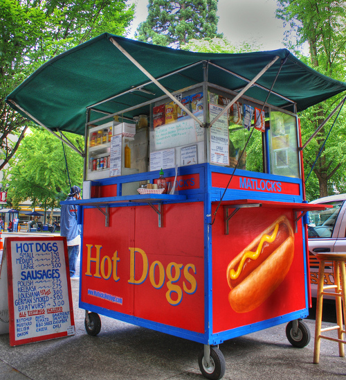 hot dog stand. The hot dog vendor had